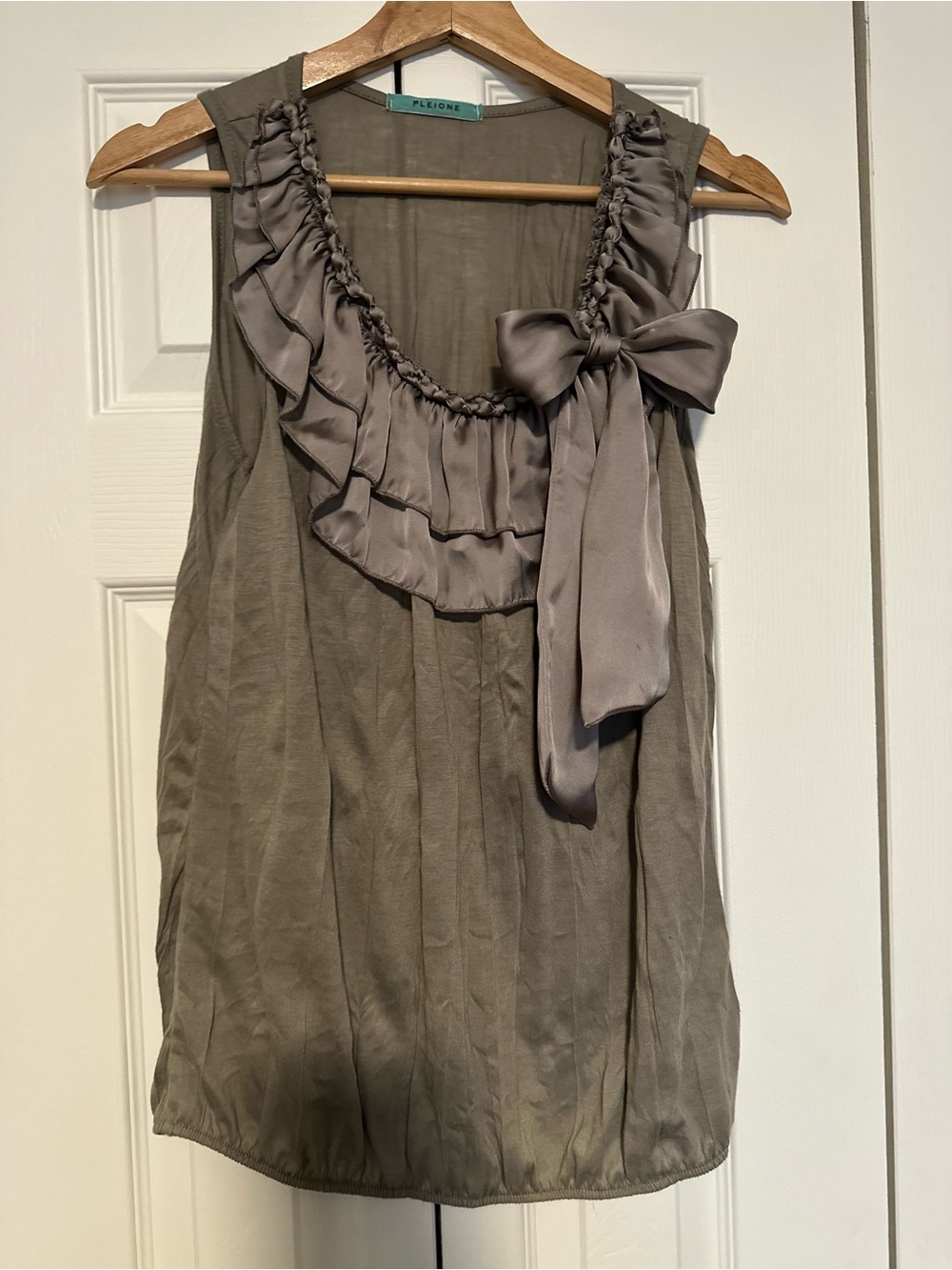 Pleione Sleeveless Ruffle Bow Tank